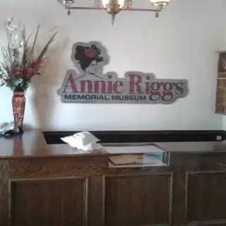 Annie Riggs lobby desk & logo